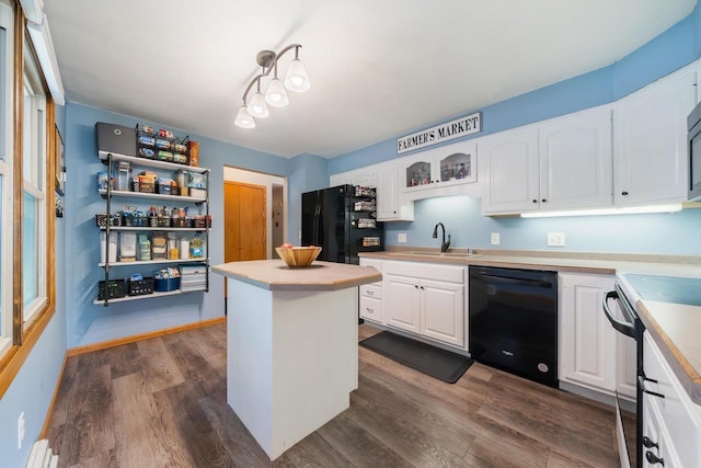 531 E Taft Ave, Appleton, WI 54915 - kitchen featuring black appliances, white cabinets, dark wood-style floors, and light countertops