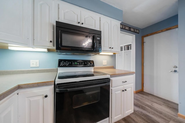 531 E Taft Ave, Appleton, WI 54915 - kitchen featuring electric stove, black microwave, light wood-style flooring, and light countertops