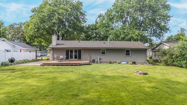 531 E Taft Ave, Appleton, WI 54915 - back of property featuring a wooden deck, an outdoor fire pit, a chimney, and french doors