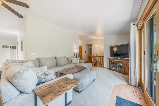 531 E Taft Ave, Appleton, WI 54915 - carpeted living room featuring healthy amount of natural light, a chandelier, and ceiling fan