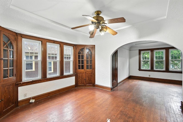 6222 W Locust St Unit 6224, Milwaukee, WI 53210 - unfurnished room featuring arched walkways, hardwood / wood-style flooring, ornamental molding, and ceiling fan