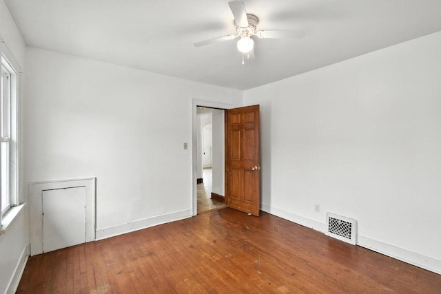 6222 W Locust St Unit 6224, Milwaukee, WI 53210 - empty room featuring hardwood / wood-style floors, a ceiling fan, and arched walkways