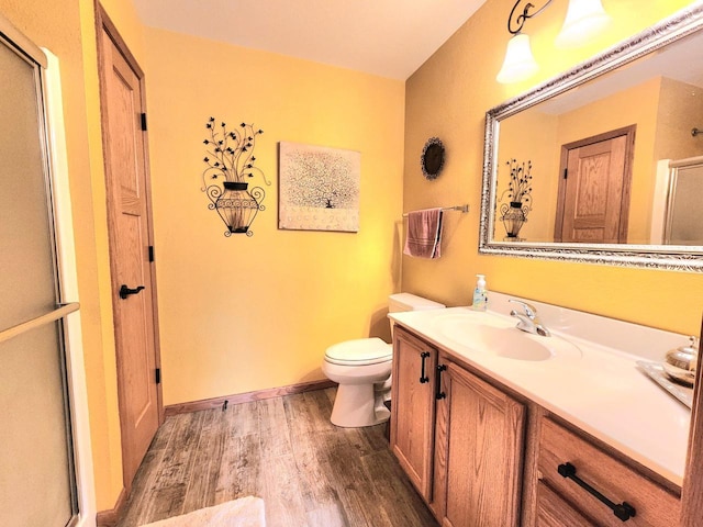 4023 Hazelnut Ct, Sheboygan, WI 53081 - bathroom featuring wood finished floors, vanity, and a shower stall
