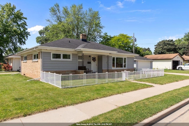 2015 E College Ave, Appleton, WI 54915 - view of front of house featuring a chimney, brick siding, a detached garage, and a porch