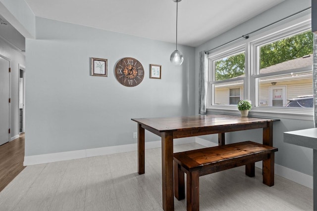 2015 E College Ave, Appleton, WI 54915 - dining space featuring baseboards