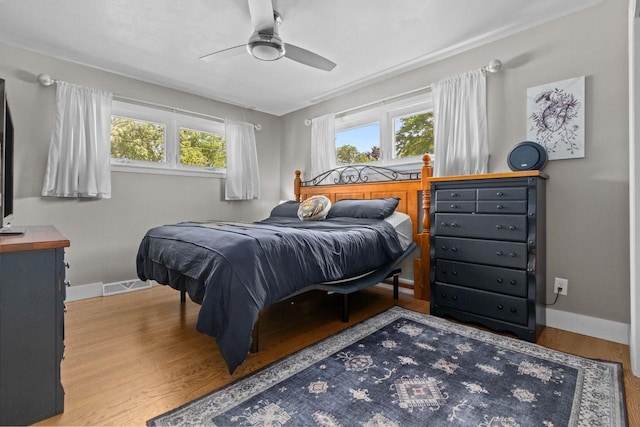 2015 E College Ave, Appleton, WI 54915 - bedroom featuring wood finished floors and ceiling fan