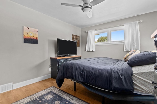 2015 E College Ave, Appleton, WI 54915 - bedroom featuring wood finished floors and ceiling fan