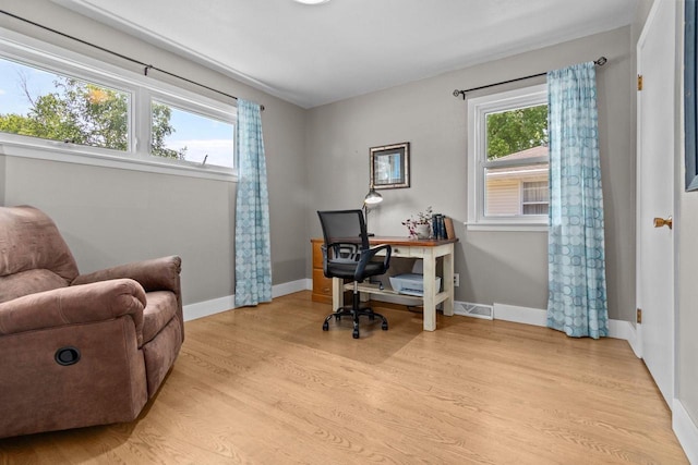 2015 E College Ave, Appleton, WI 54915 - home office featuring light wood-style floors and baseboards