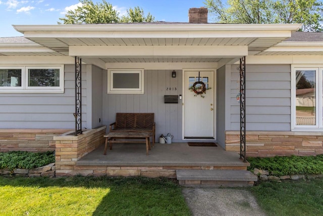 2015 E College Ave, Appleton, WI 54915 - view of exterior entry featuring a chimney