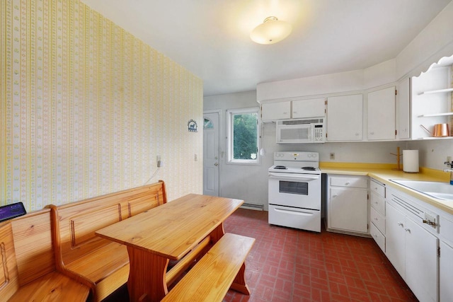 3613 Spenser Ln, Madison, WI 53704 - kitchen featuring white appliances, brick patterned floors, white cabinets, open shelves, and light countertops