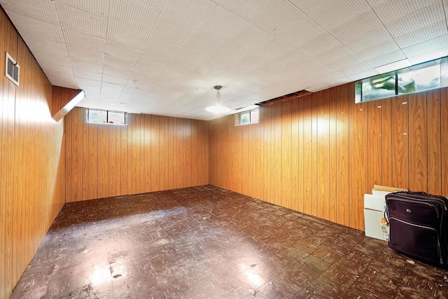 3613 Spenser Ln, Madison, WI 53704 - basement featuring wooden walls, tile patterned floors, and plenty of natural light