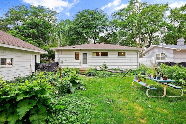 3613 Spenser Ln, Madison, WI 53704 - rear view of house featuring a yard