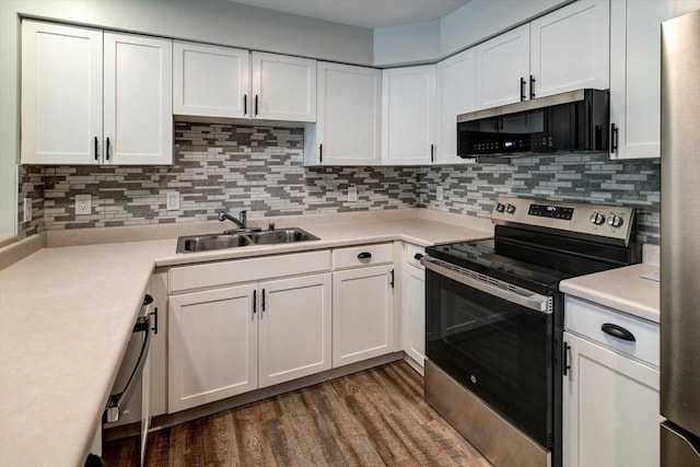 201 Kearney Way Unit 201, Waunakee, WI 53597 - kitchen featuring stainless steel range with electric cooktop, white cabinets, dark wood-type flooring, light countertops, and tasteful backsplash