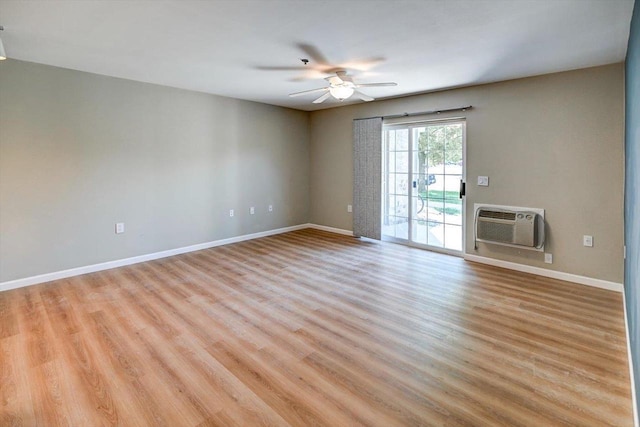 201 Kearney Way Unit 201, Waunakee, WI 53597 - empty room with ceiling fan, light wood-style floors, and an AC wall unit