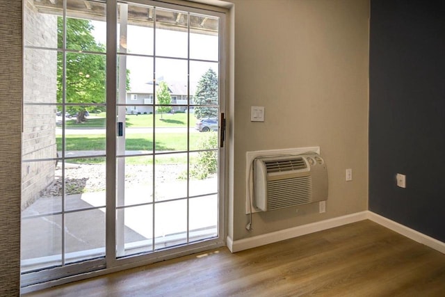 201 Kearney Way Unit 201, Waunakee, WI 53597 - entryway featuring wood finished floors and a wall unit AC