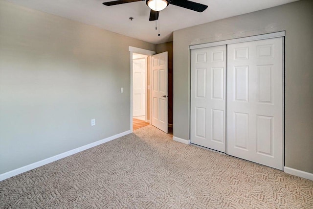 201 Kearney Way Unit 201, Waunakee, WI 53597 - unfurnished bedroom featuring light colored carpet, a closet, and ceiling fan