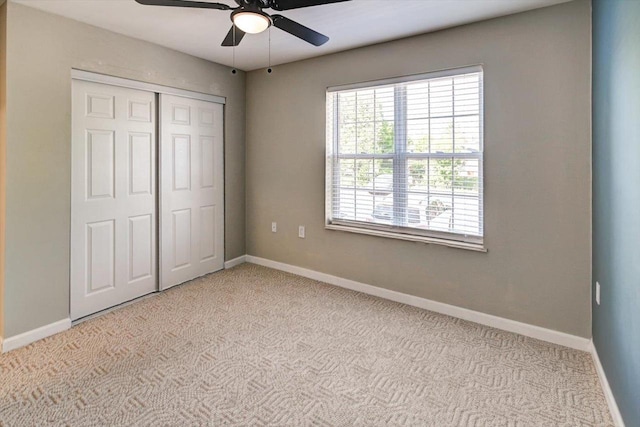 201 Kearney Way Unit 201, Waunakee, WI 53597 - unfurnished bedroom with carpet floors, a closet, and ceiling fan