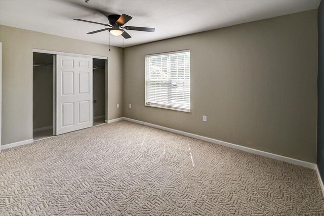 201 Kearney Way Unit 201, Waunakee, WI 53597 - unfurnished bedroom featuring carpet flooring, a closet, and a ceiling fan