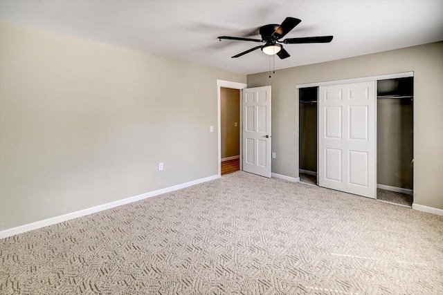 201 Kearney Way Unit 201, Waunakee, WI 53597 - unfurnished bedroom with carpet, a closet, and a ceiling fan