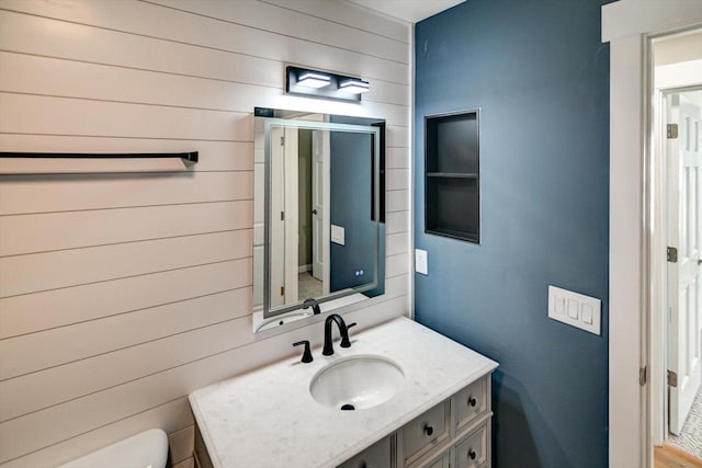 201 Kearney Way Unit 201, Waunakee, WI 53597 - bathroom featuring vanity and wooden walls