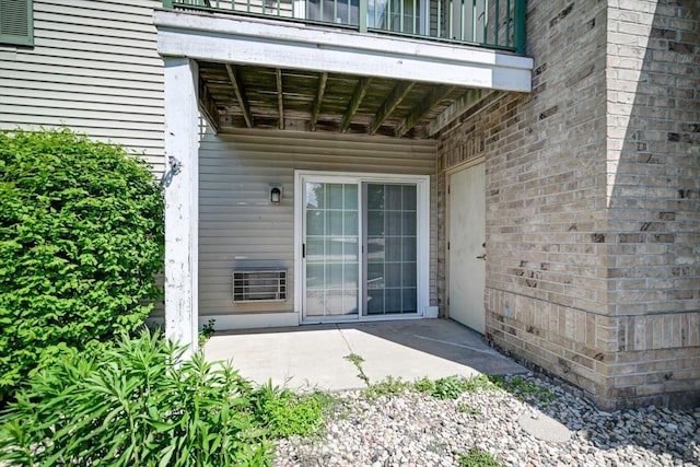 201 Kearney Way Unit 201, Waunakee, WI 53597 - doorway to property featuring a balcony and a patio area