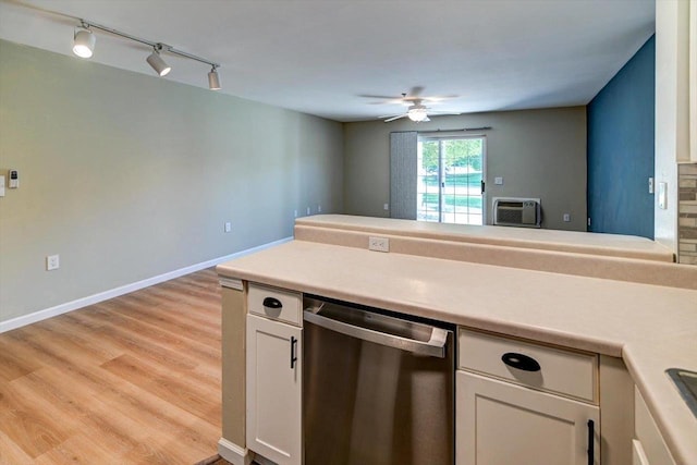 201 Kearney Way Unit 201, Waunakee, WI 53597 - kitchen with stainless steel dishwasher, track lighting, a ceiling fan, light countertops, and light wood-style floors
