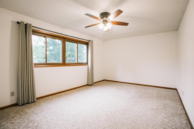 403 Bluebird Ln, Loyal, WI 54446 - empty room featuring light colored carpet, a ceiling fan, and a textured ceiling
