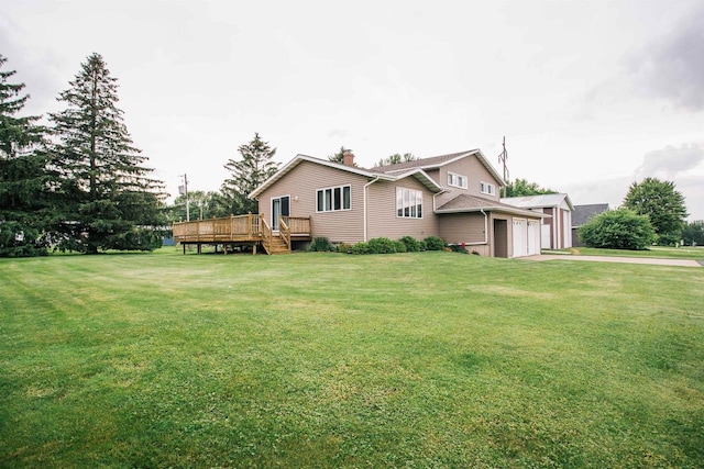 403 Bluebird Ln, Loyal, WI 54446 - view of front of house featuring an attached garage, a wooden deck, a front lawn, asphalt driveway, and a chimney
