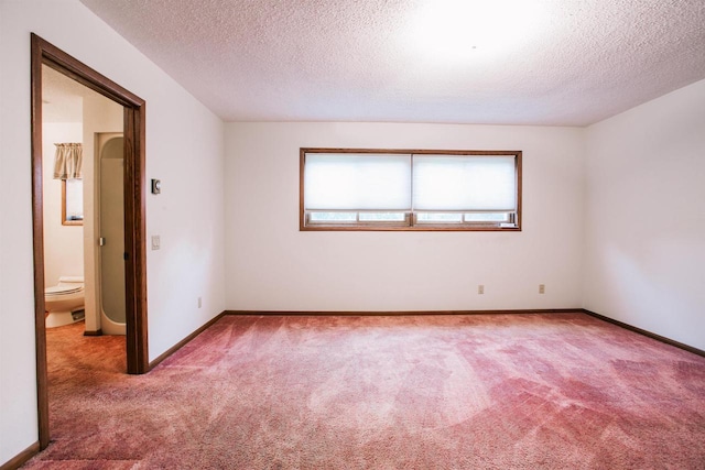 403 Bluebird Ln, Loyal, WI 54446 - empty room with carpet floors and a textured ceiling
