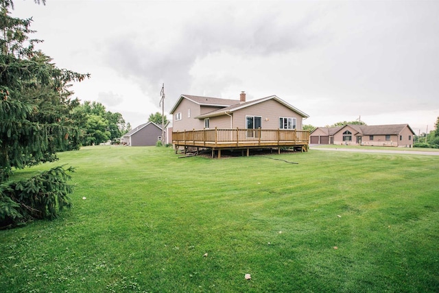 403 Bluebird Ln, Loyal, WI 54446 - rear view of house with a lawn and a wooden deck