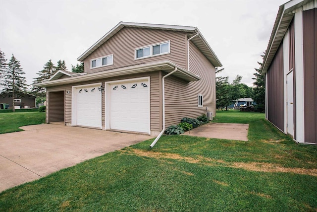 403 Bluebird Ln, Loyal, WI 54446 - view of side of property featuring a garage, a lawn, and driveway