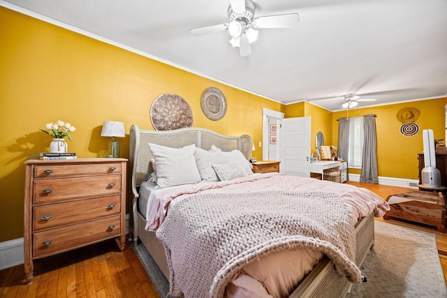 622 Grant St, Fort Atkinson, WI 53538 - bedroom featuring ornamental molding, dark wood-type flooring, and ceiling fan