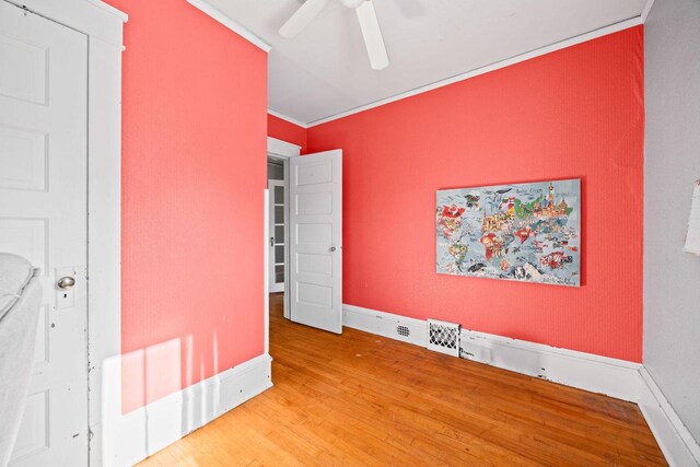 622 Grant St, Fort Atkinson, WI 53538 - unfurnished bedroom with wood finished floors, ornamental molding, and ceiling fan