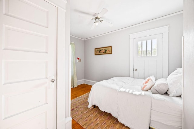 622 Grant St, Fort Atkinson, WI 53538 - bedroom with wood finished floors, ceiling fan, and ornamental molding