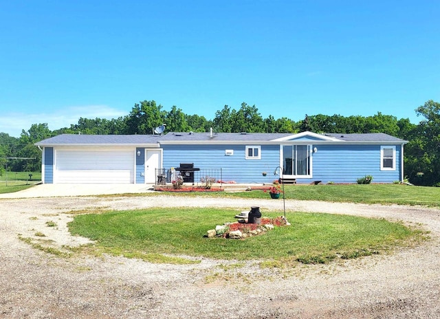 W6747 Legler Valley Rd, New Glarus, WI 53574 - ranch-style home featuring a front yard, a garage, and driveway