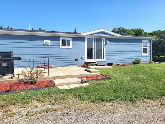 W6747 Legler Valley Rd, New Glarus, WI 53574 - back of property with a yard, a patio, and entry steps