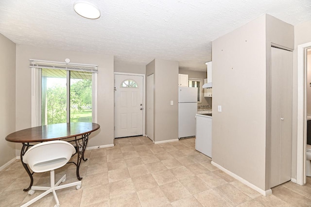 9618 W Bradley Rd, Milwaukee, WI 53224 - entrance foyer with baseboards and a textured ceiling