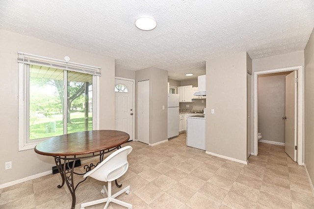 9618 W Bradley Rd, Milwaukee, WI 53224 - dining area featuring baseboards and a textured ceiling