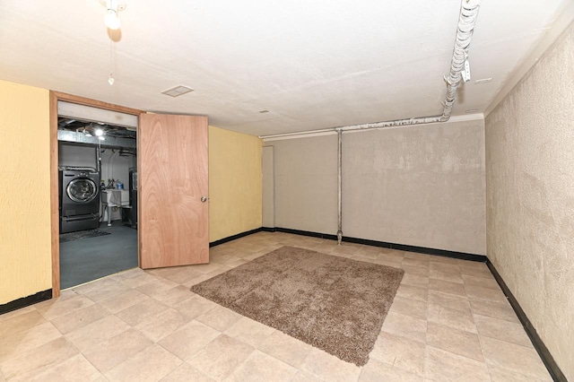 9618 W Bradley Rd, Milwaukee, WI 53224 - finished below grade area with washer / clothes dryer and a textured wall