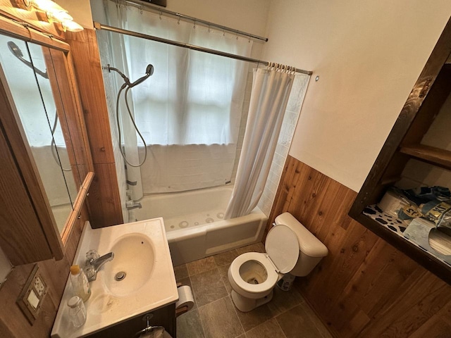 211 N Main St, Viola, WI 54664 - full bath featuring shower / tub combo, vanity, a wainscoted wall, and wooden walls