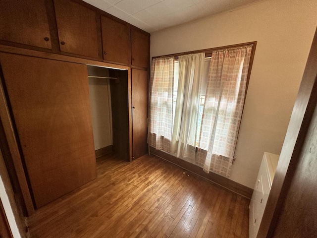211 N Main St, Viola, WI 54664 - unfurnished bedroom with hardwood / wood-style floors and a closet