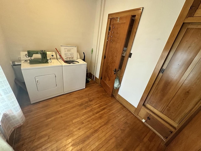 211 N Main St, Viola, WI 54664 - laundry room featuring washing machine and dryer and light wood-type flooring