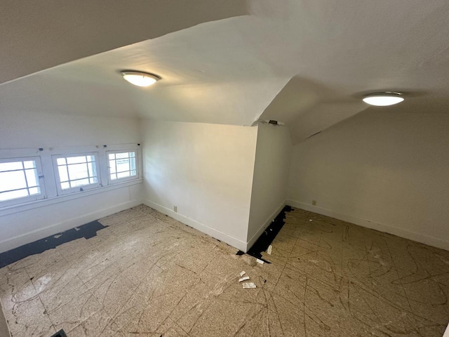 211 N Main St, Viola, WI 54664 - bonus room featuring lofted ceiling and baseboards
