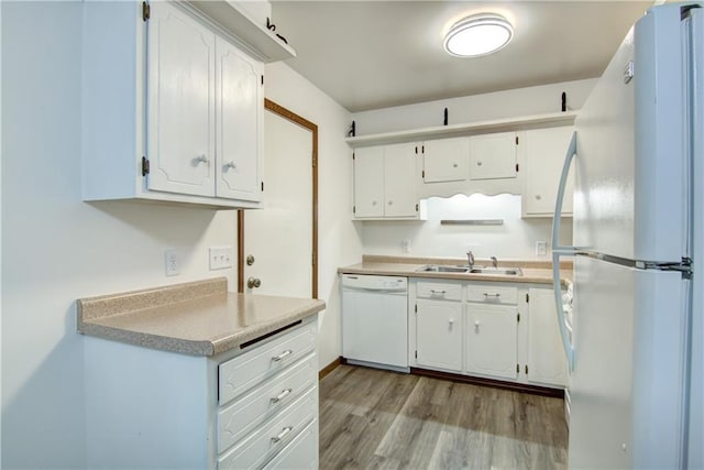 3474 Delbert Rd, Eau Claire, WI 54703 - kitchen with white appliances, wood finished floors, and white cabinets