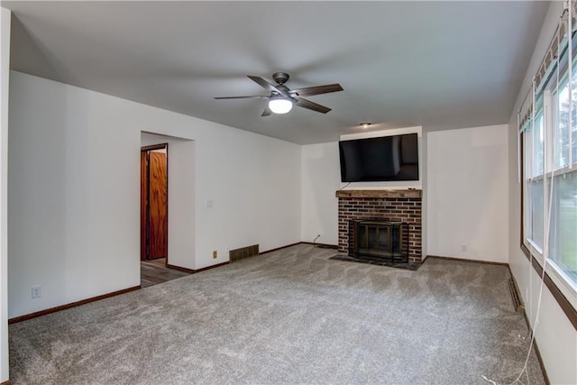 3474 Delbert Rd, Eau Claire, WI 54703 - unfurnished living room featuring carpet flooring, a ceiling fan, and a fireplace