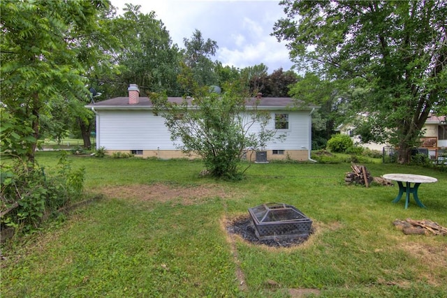 3474 Delbert Rd, Eau Claire, WI 54703 - view of green lawn with an outdoor fire pit