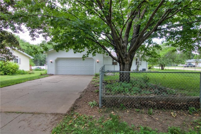 3474 Delbert Rd, Eau Claire, WI 54703 - view of property hidden behind natural elements featuring concrete driveway and a garage