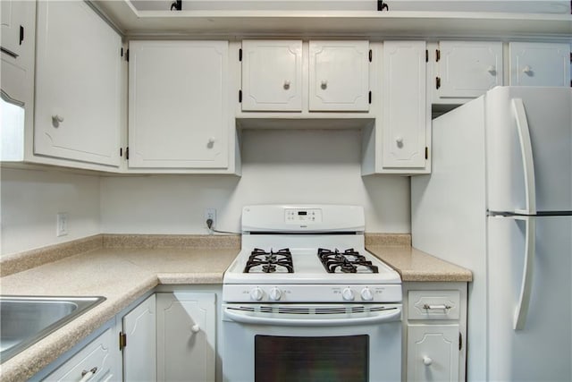 3474 Delbert Rd, Eau Claire, WI 54703 - kitchen with white appliances, white cabinetry, and light countertops