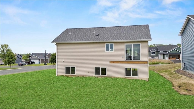 198 Pintail St, Baldwin, WI 54002 - rear view of house with a lawn, a residential view, and a shingled roof