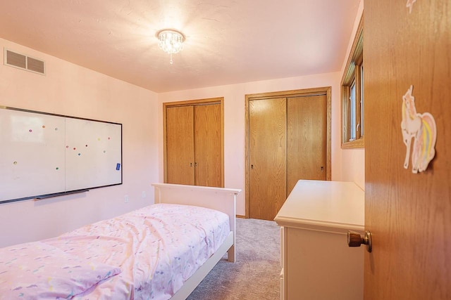 630 Brule Rd Unit 11, De Pere, WI 54115 - bedroom with light colored carpet and two closets